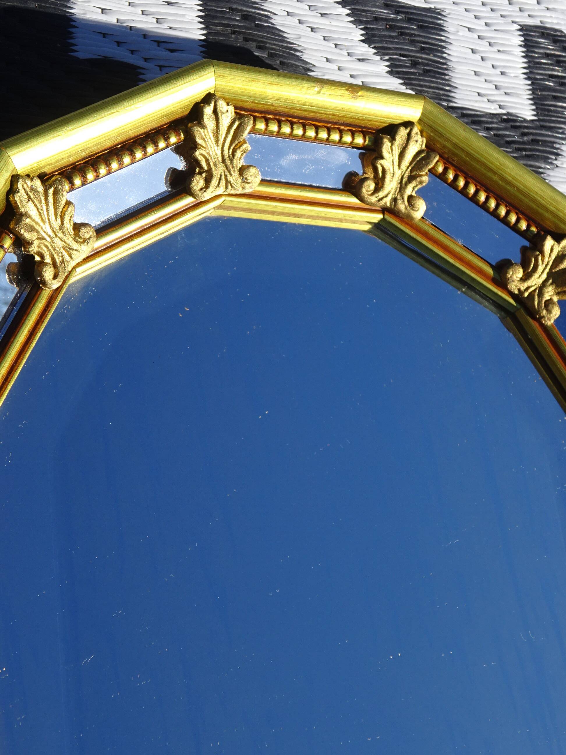 Hall mirror, gilded frame with fillets and fleur-de-lis.