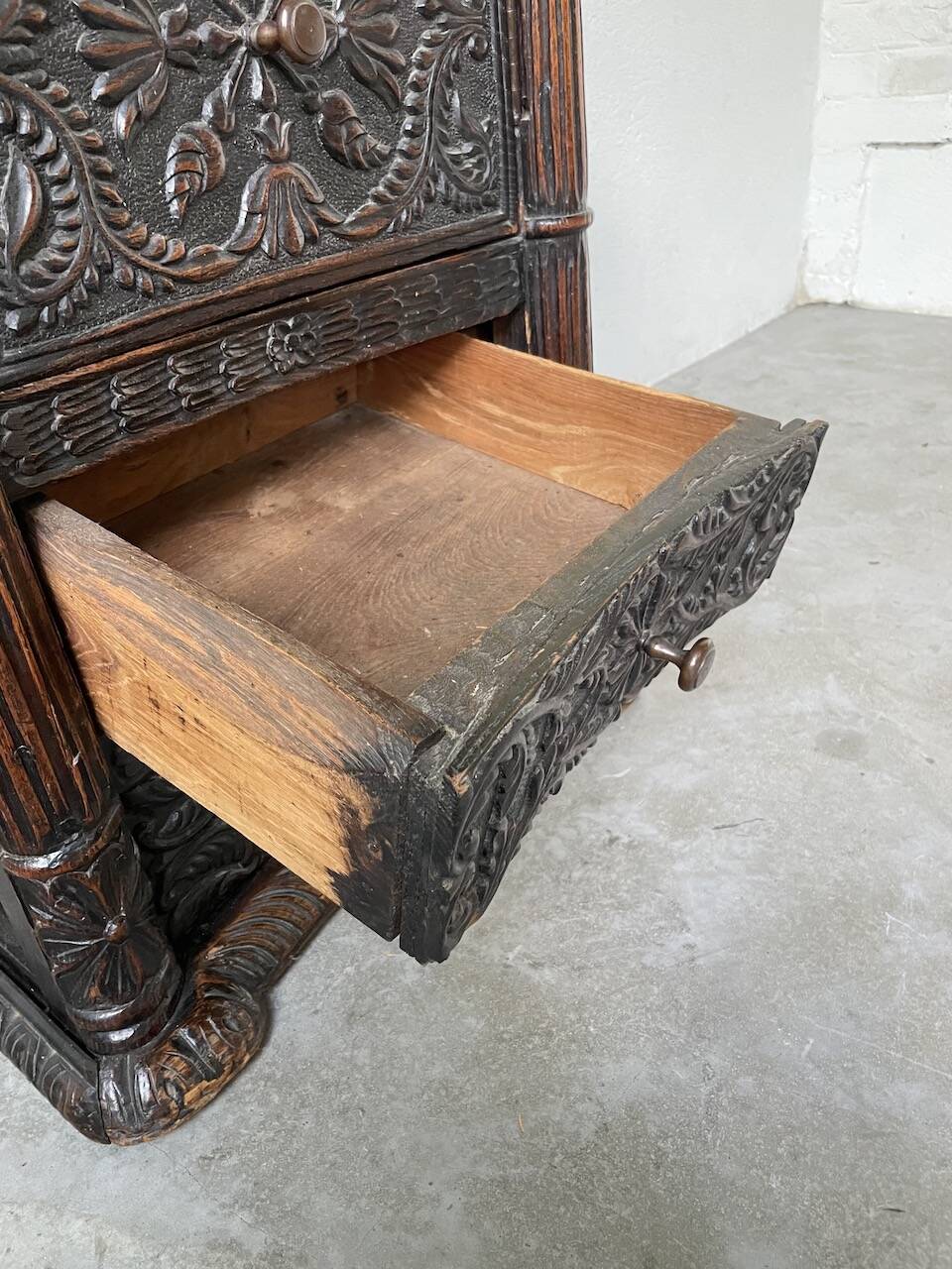 19th century chest of drawers in carved blackened pine