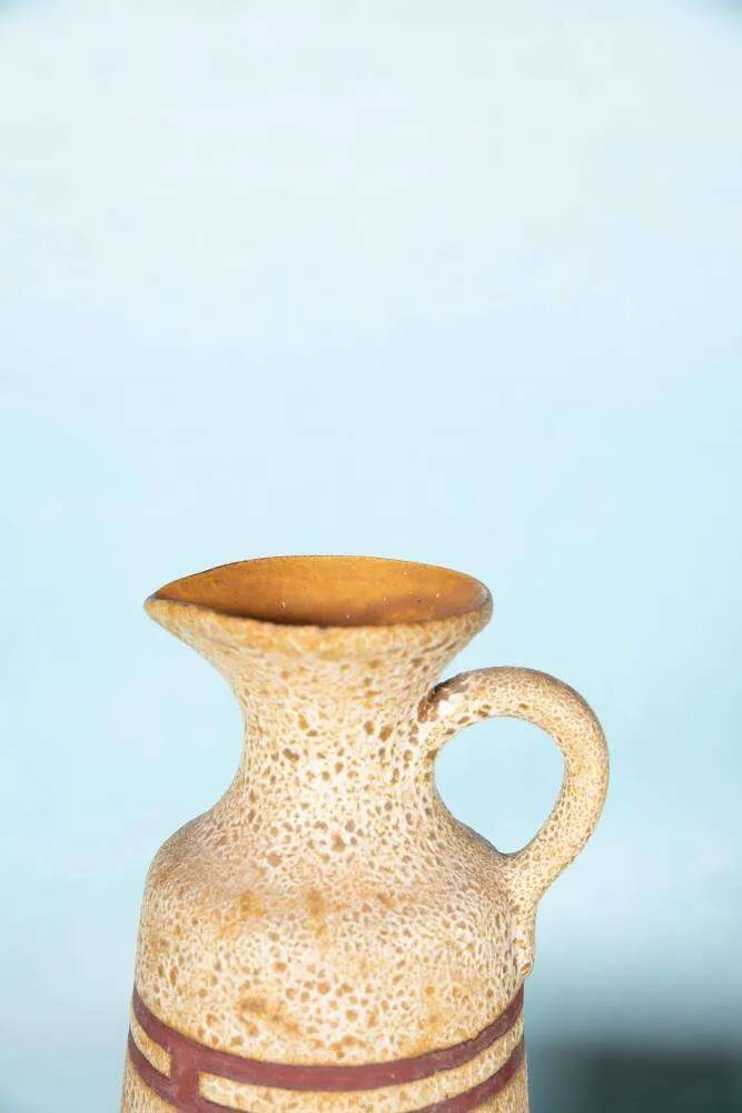 Vintage vase from the 60s, W-Germany footed vase in caramel yellow.