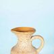 Vintage vase from the 60s, W-Germany footed vase in caramel yellow.