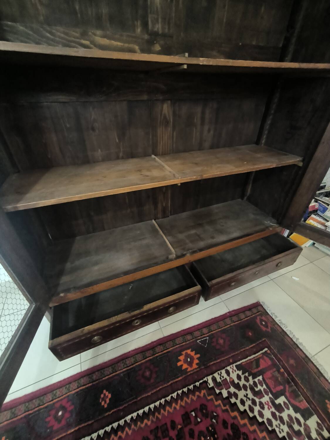 Library in marquetry with a grille from the Louis XVI period.