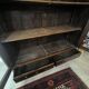 Library in marquetry with a grille from the Louis XVI period.