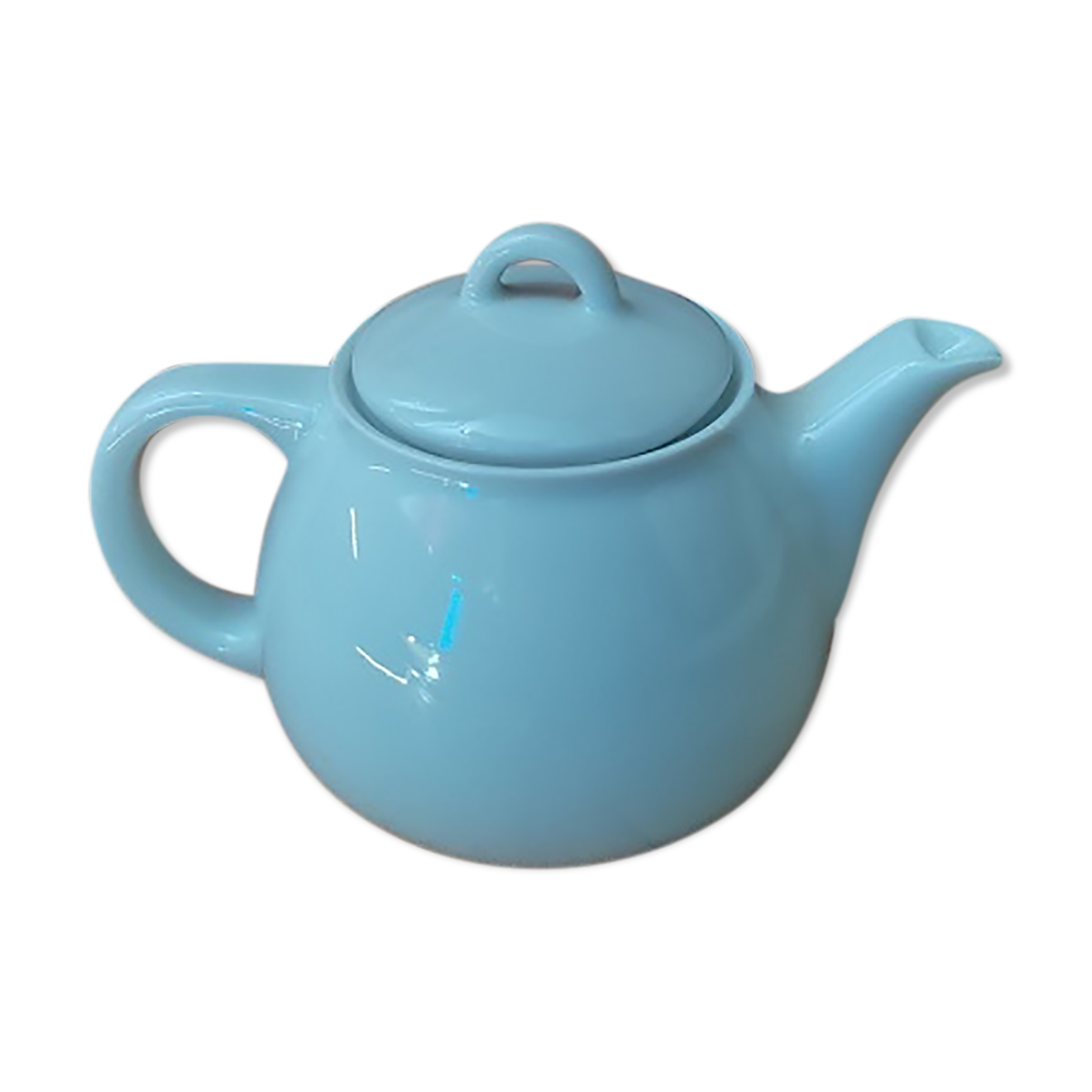 Tea pitcher teapot in old vintage white porcelain