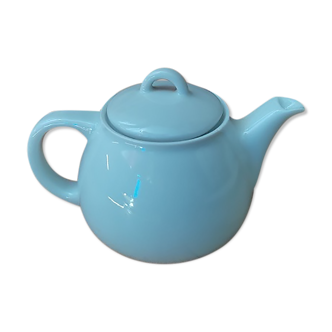 Tea pitcher teapot in old vintage white porcelain