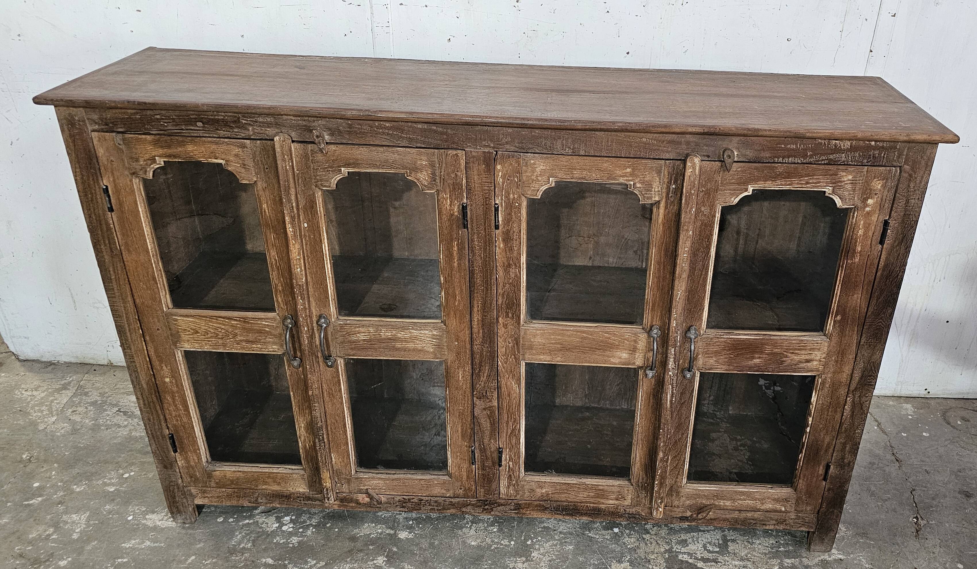 Antique glass-fronted buffet in Burmese teak