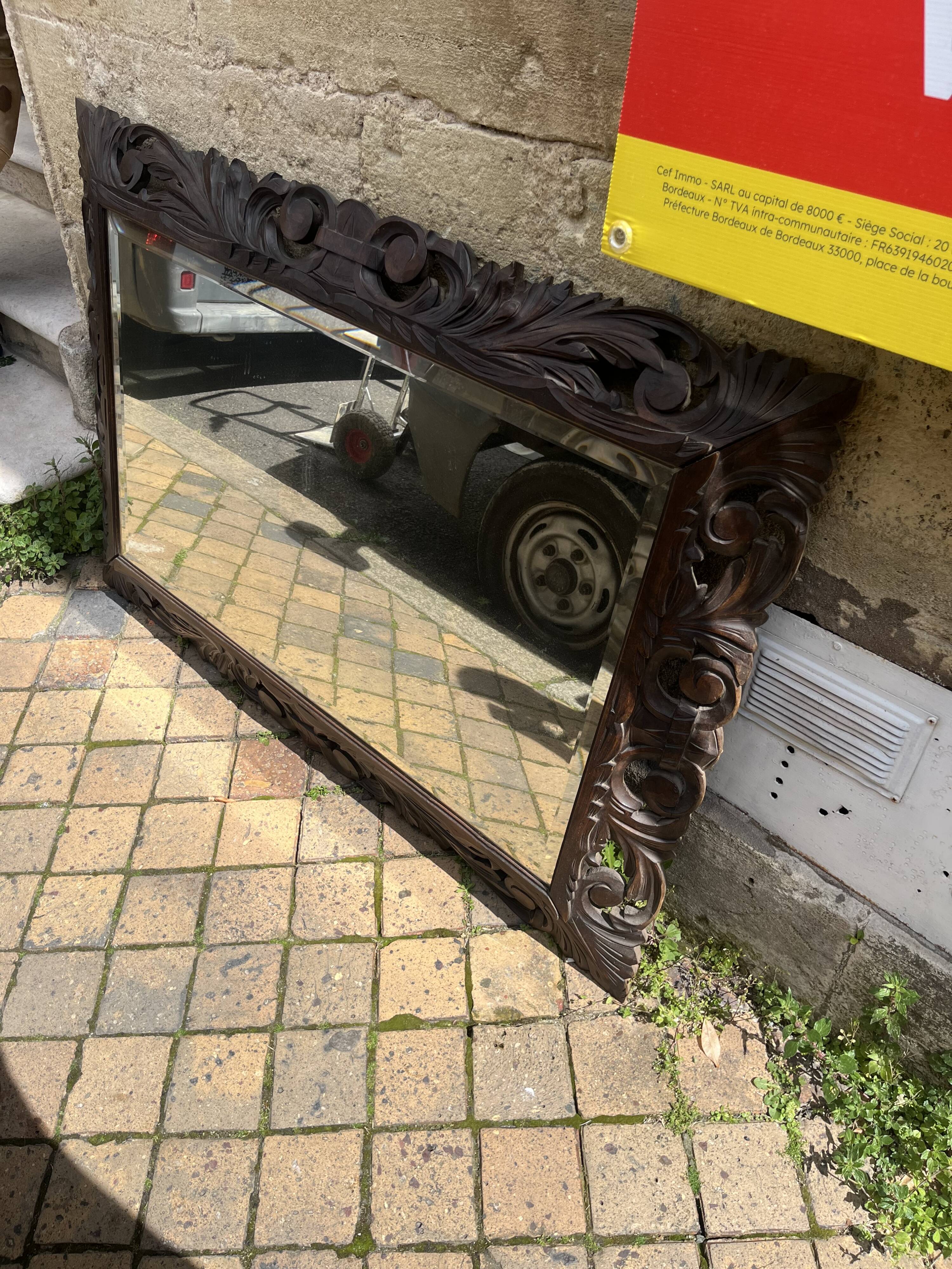 Antique mirror in carved wood