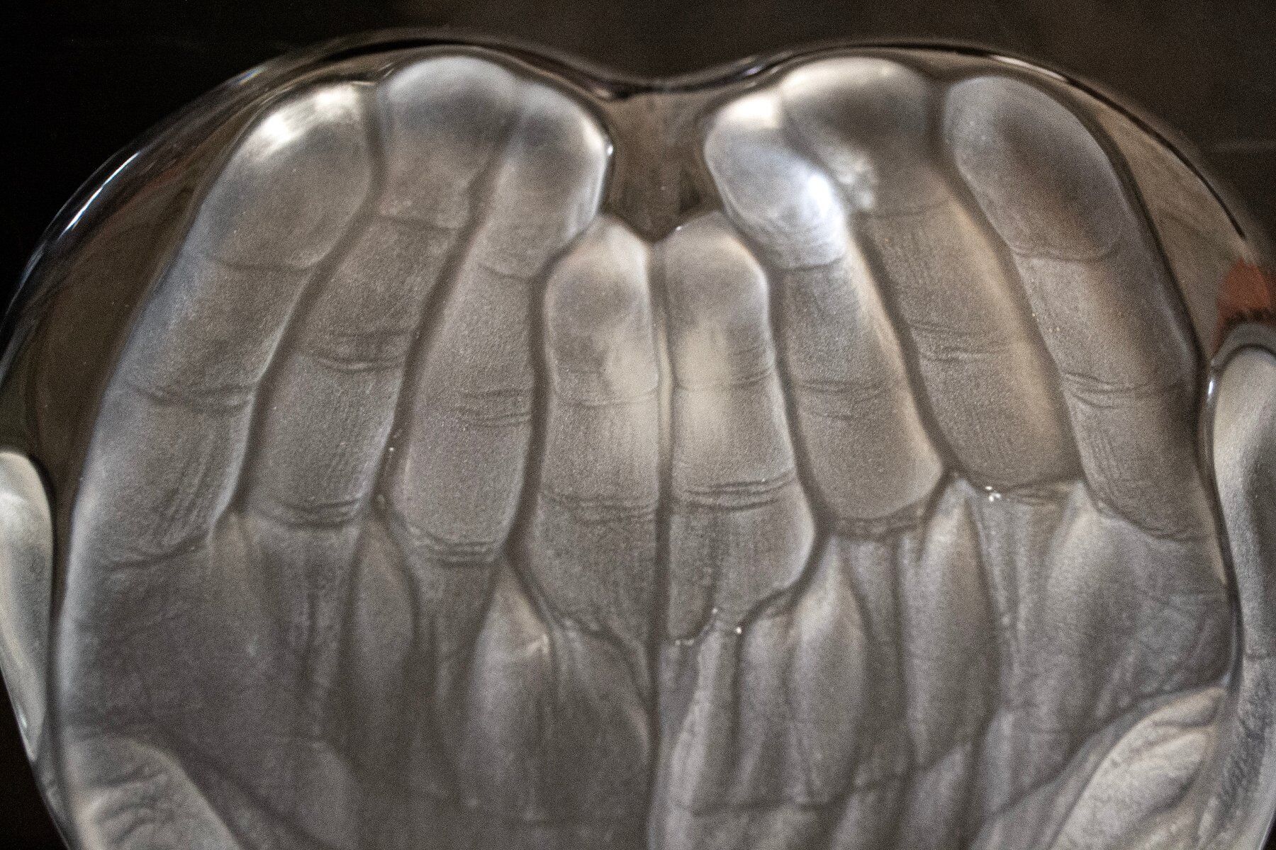 Crystal sculpture with a heart supported by hands by Tony Morgan for Daum, 1970s.