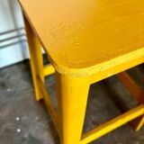 Yellow wooden stool