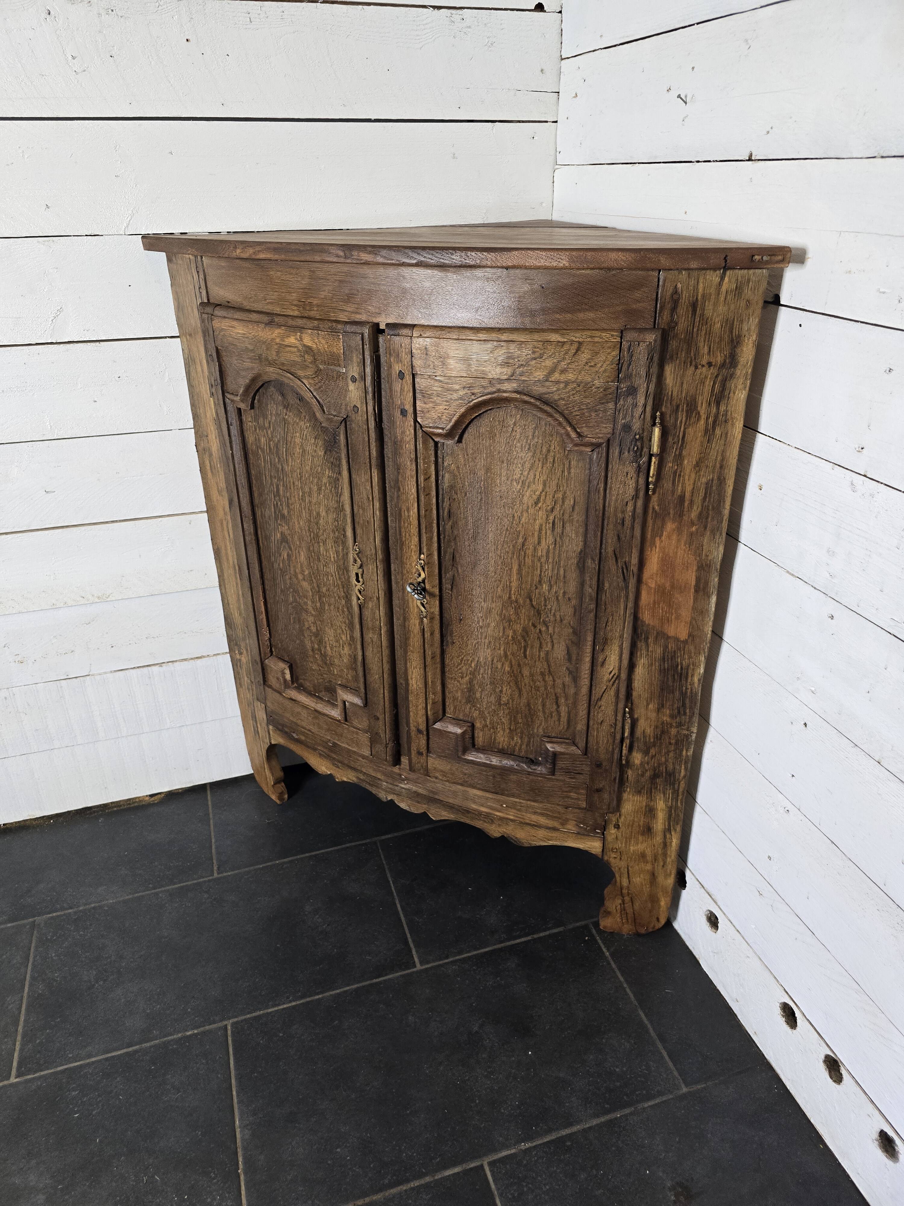 19th century curved corner cupboard in oak