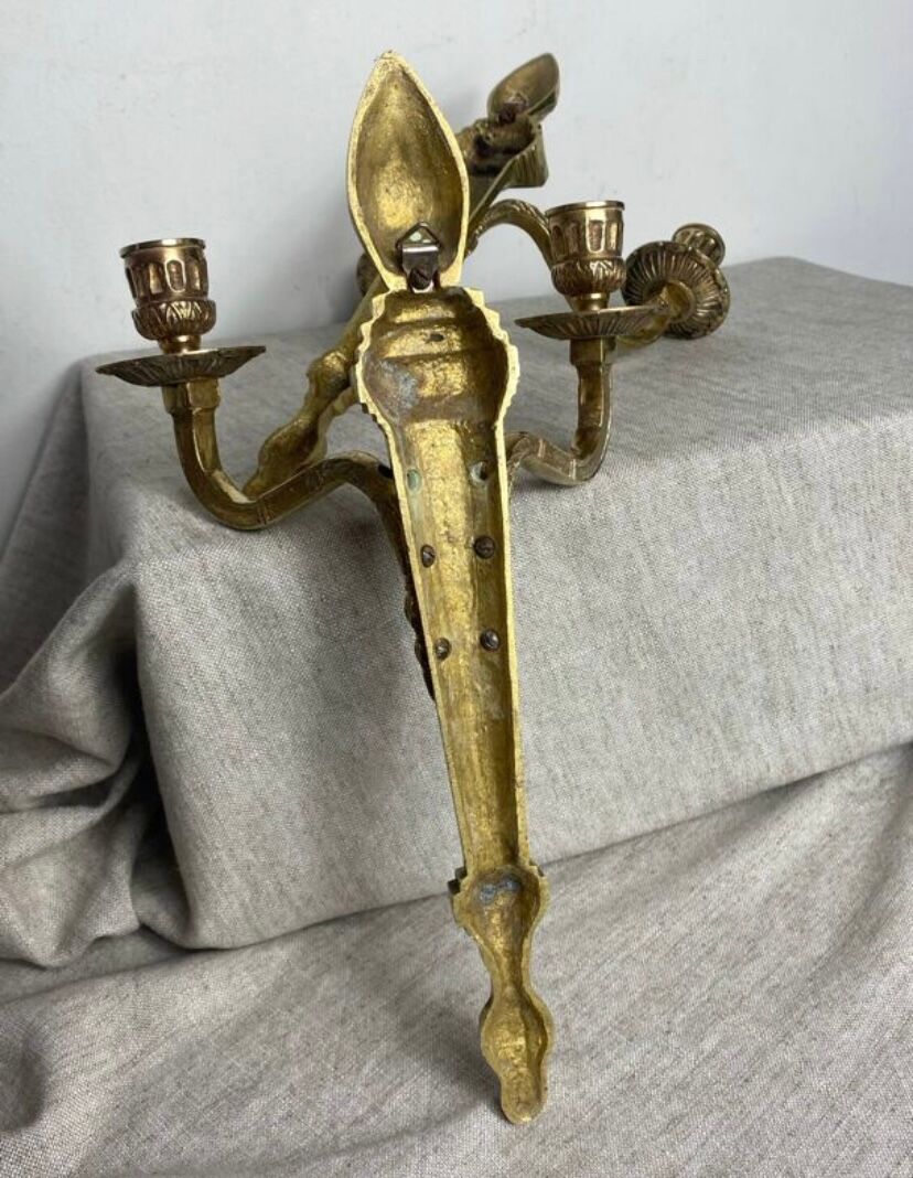 Pair of wall candle holders in bronze