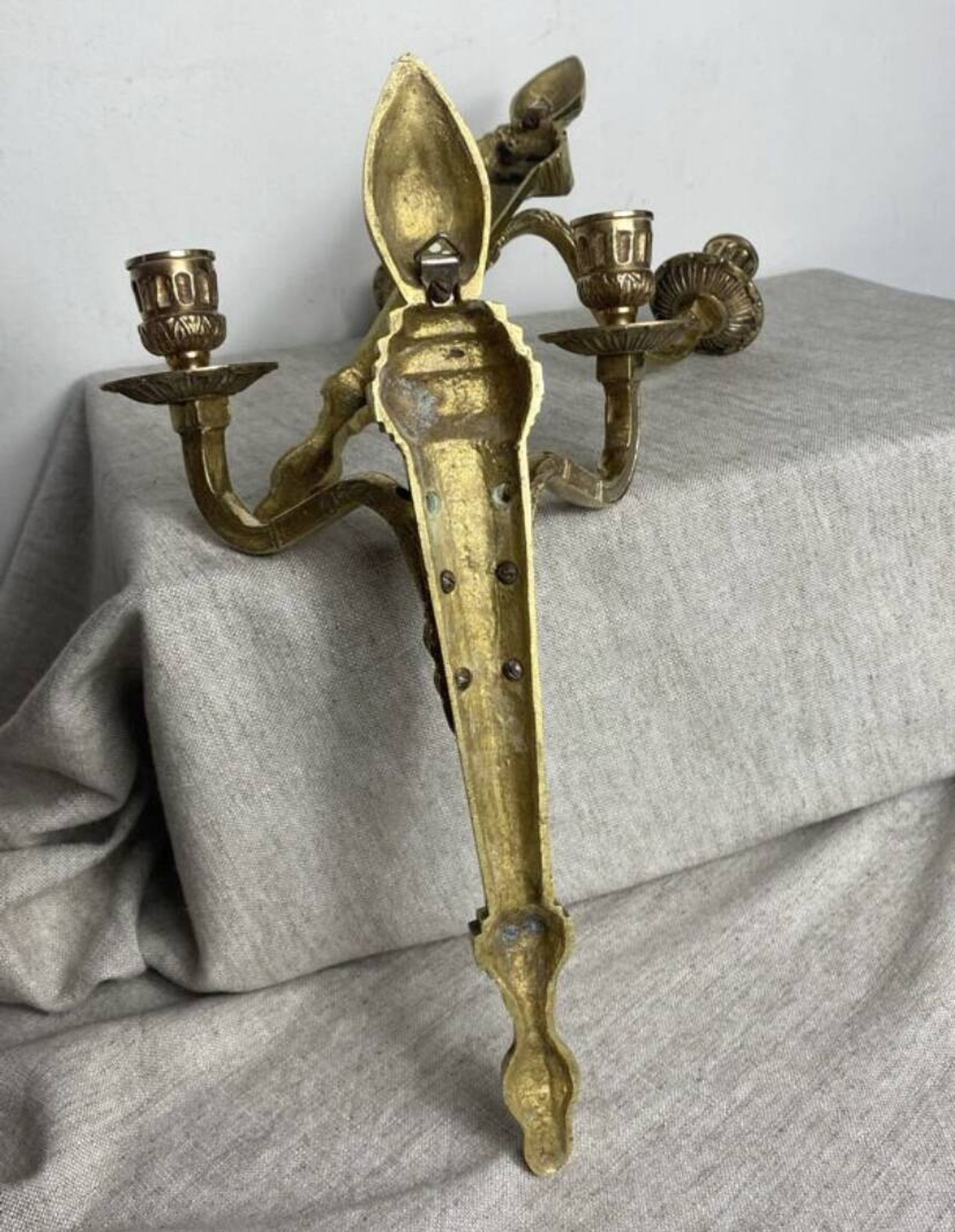 Pair of wall candle holders in bronze