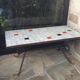 Coffee table, ceramic top, wrought iron foot