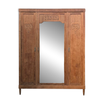 Art deco wardrobe in raw oak with bevelled mirror.
