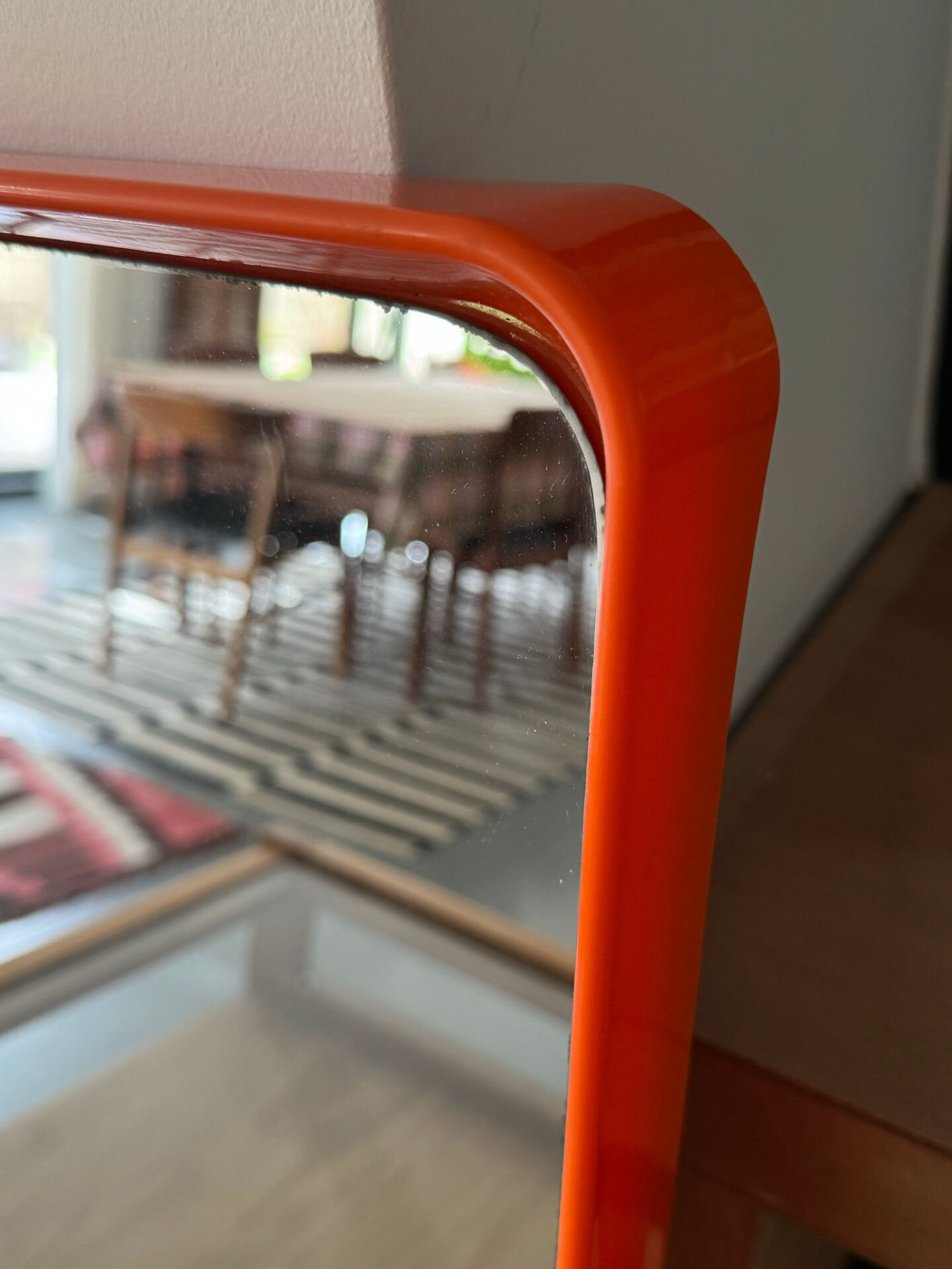 Orange moulded plastic mirror