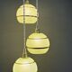 Suspension triple vintage glass globes in frosted green and gold.