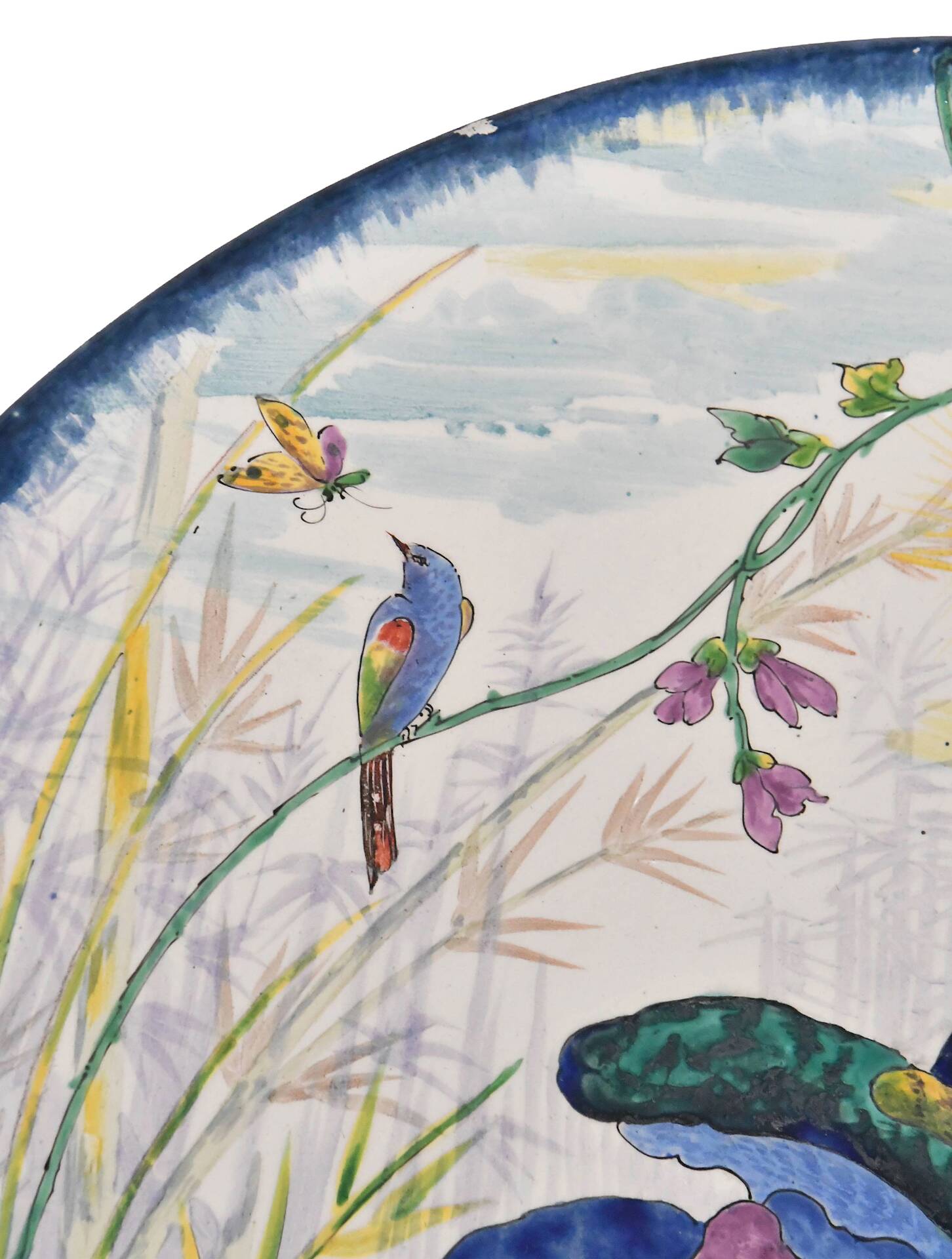 Large earthenware dish decorated with a parrot.