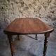 Antique drop-leaf dining table in walnut, France, circa 1900.