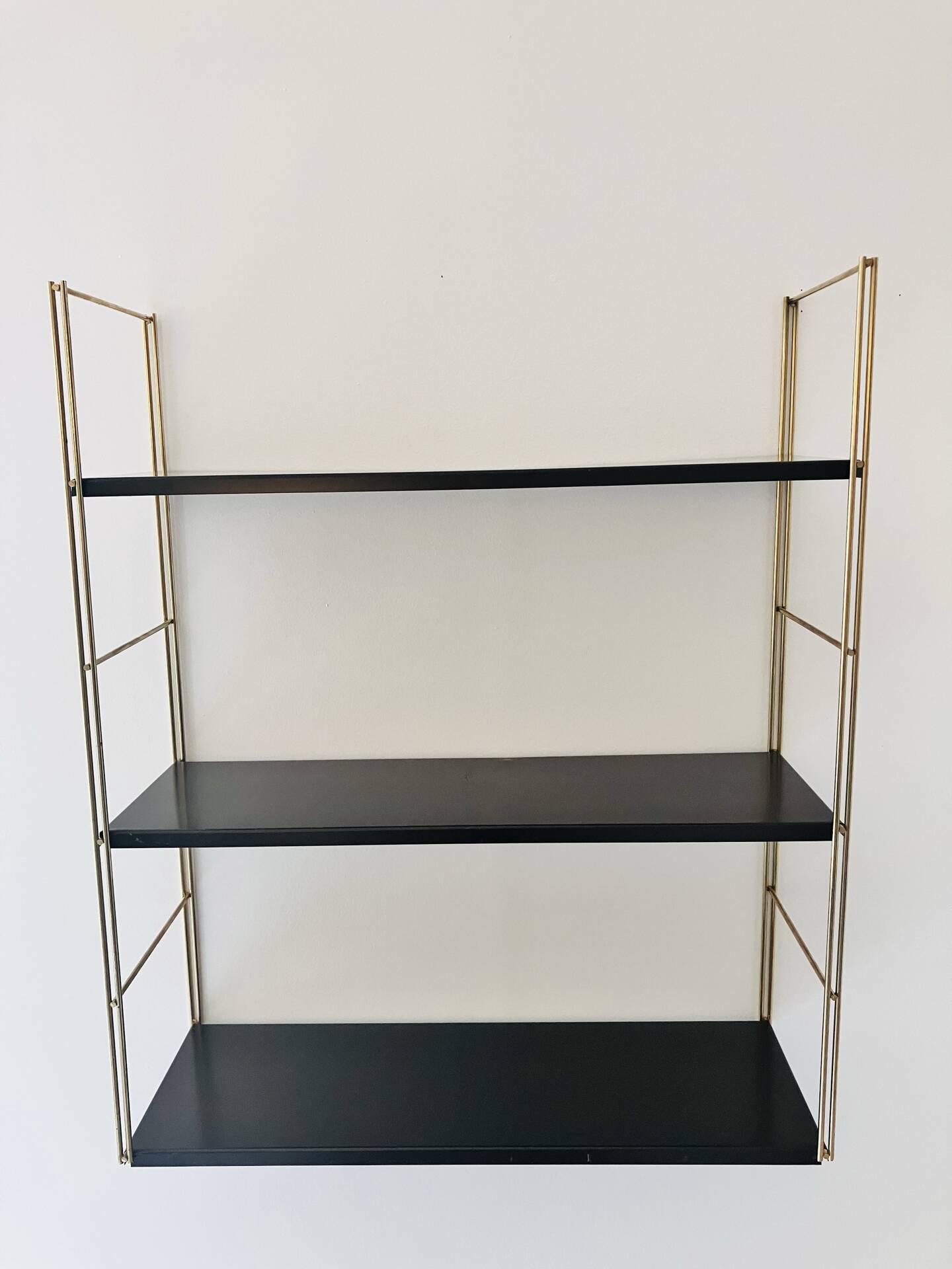 Gold and brown String wall shelves