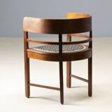 Central European armchair from the early 20th century with an inlaid backrest.