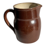 Pitcher in dark brown sandstone glazed with dotted frieze patterns