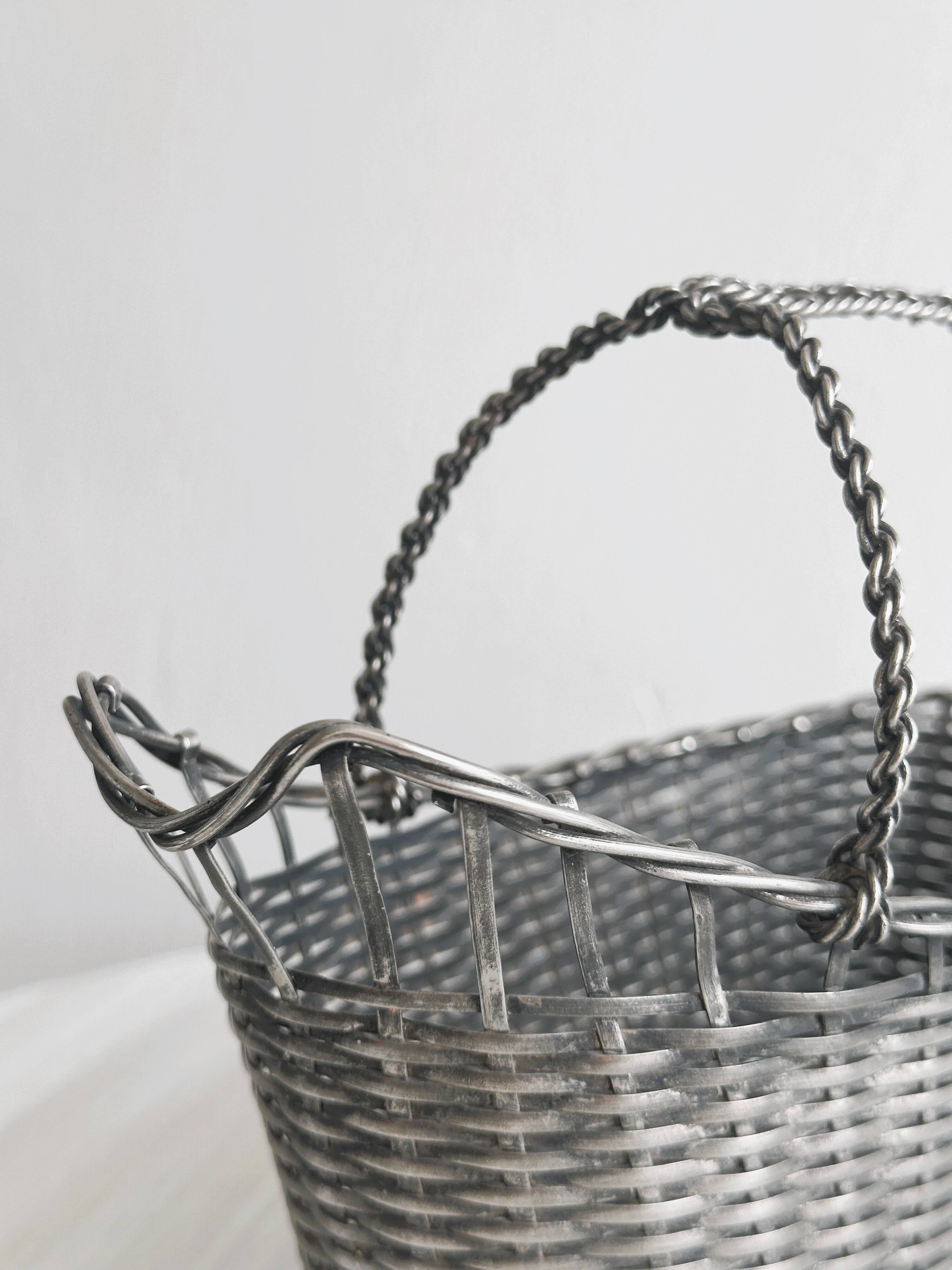 Woven metal wine basket