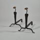 Pair of handforged metal and brass andirons