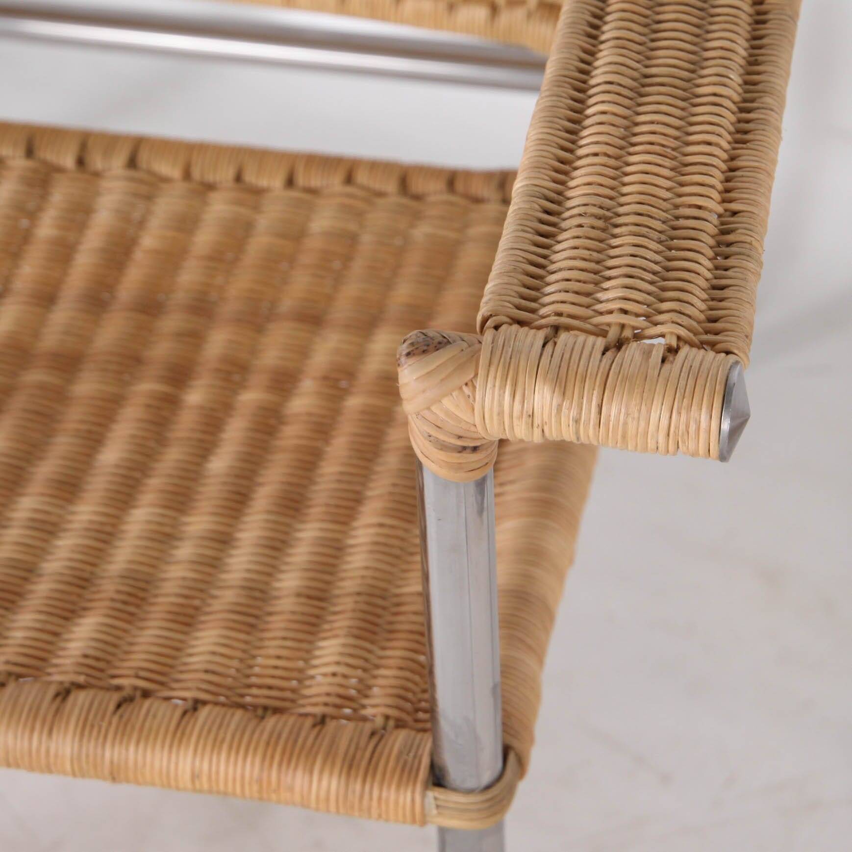 Pair of wicker and chrome armchairs