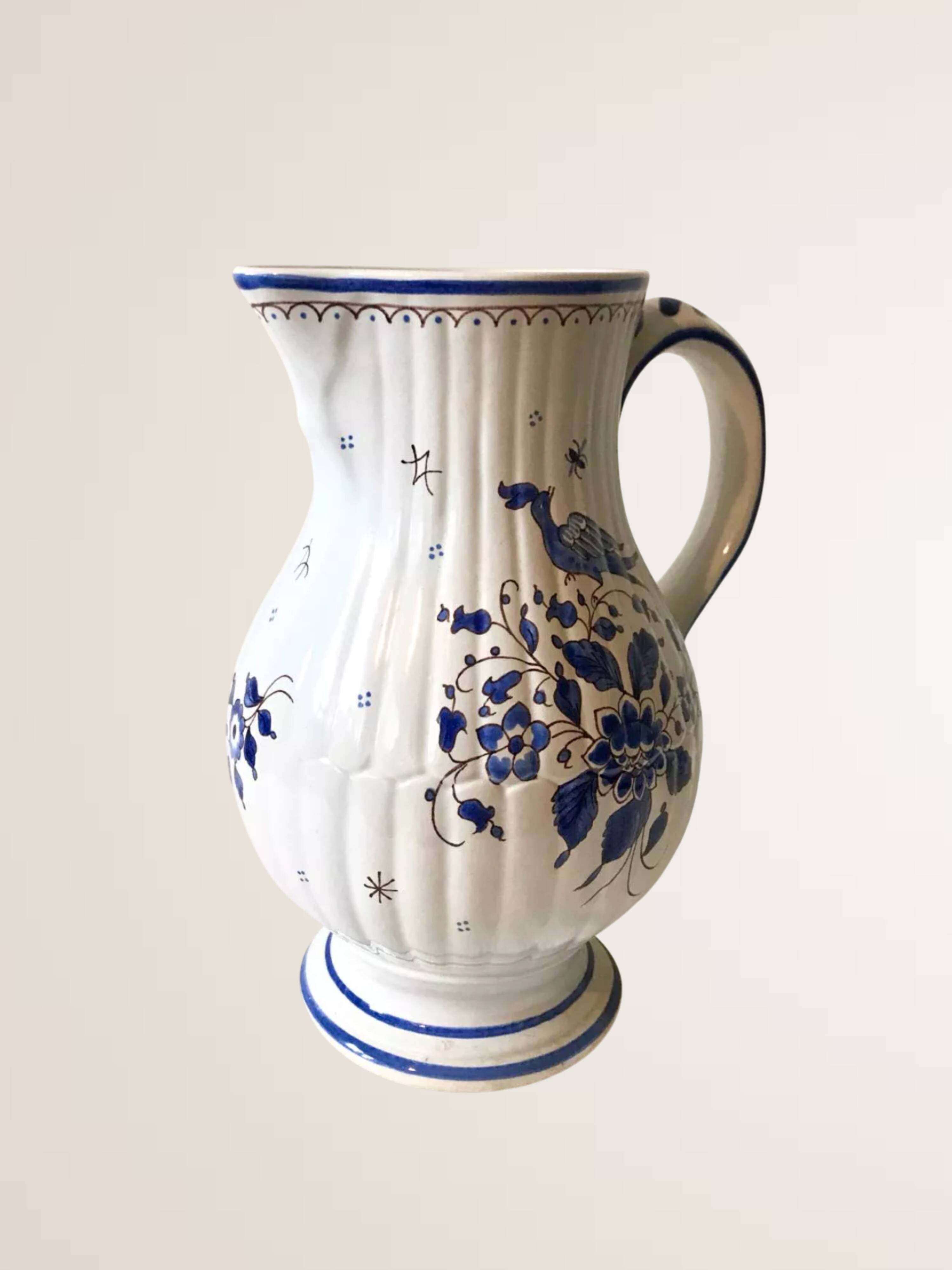 Moutiers earthenware jug, hand-painted blue decoration.