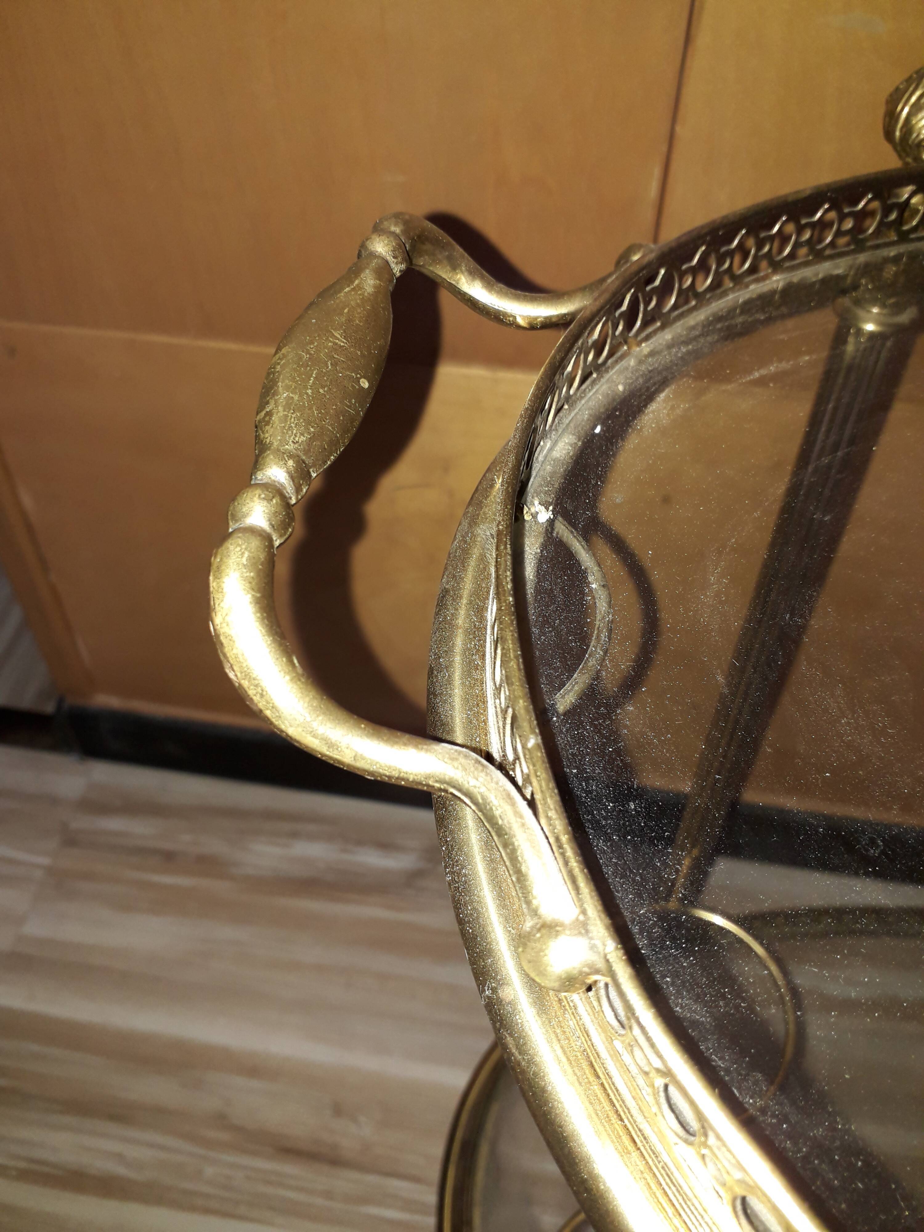 Dessert on brass wheels and glass door bottles year 60