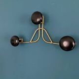 Golden brass coat rack with 3 black vintage hooks from the Mid Century 1950-60.