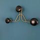 Golden brass coat rack with 3 black vintage hooks from the Mid Century 1950-60.