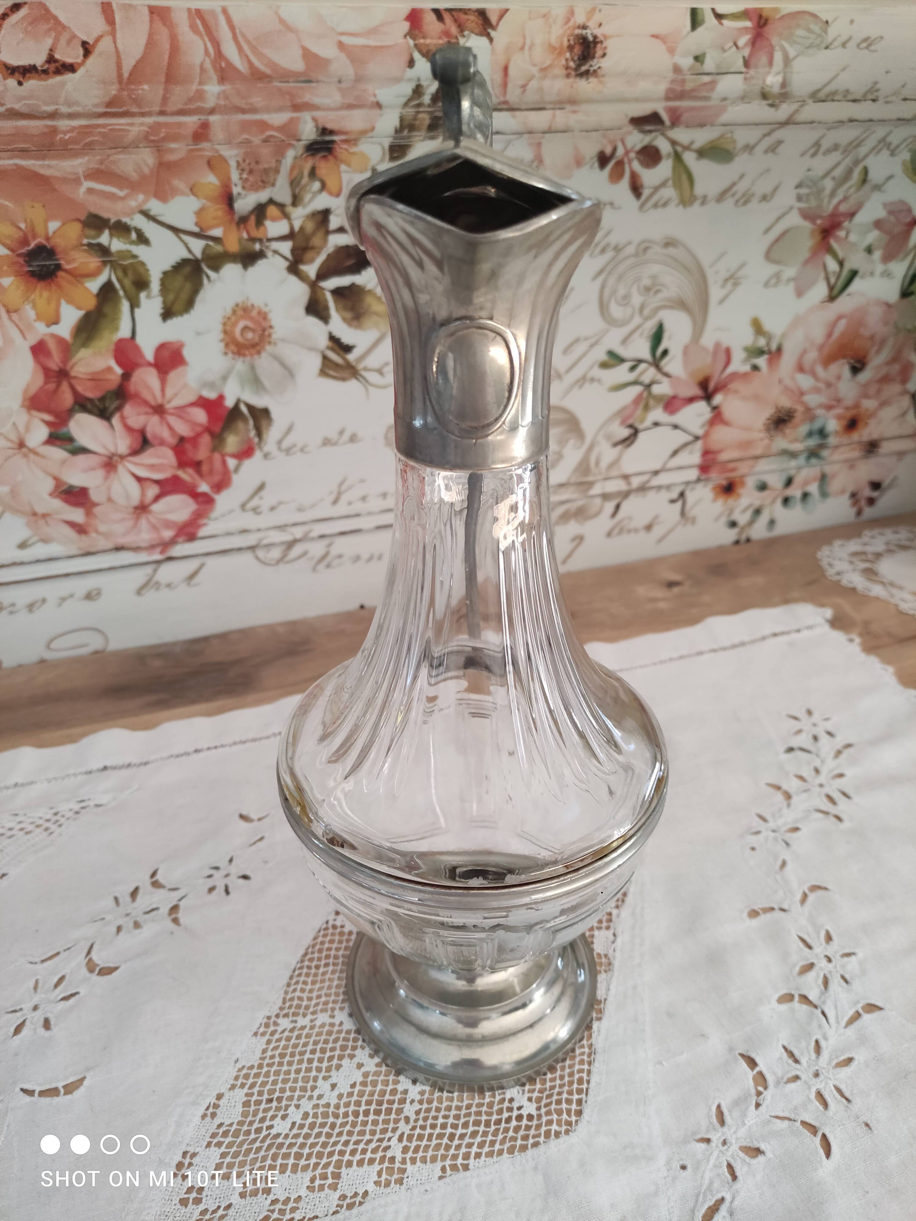 Old water decanter in curved glass and tin Art Nouveau style