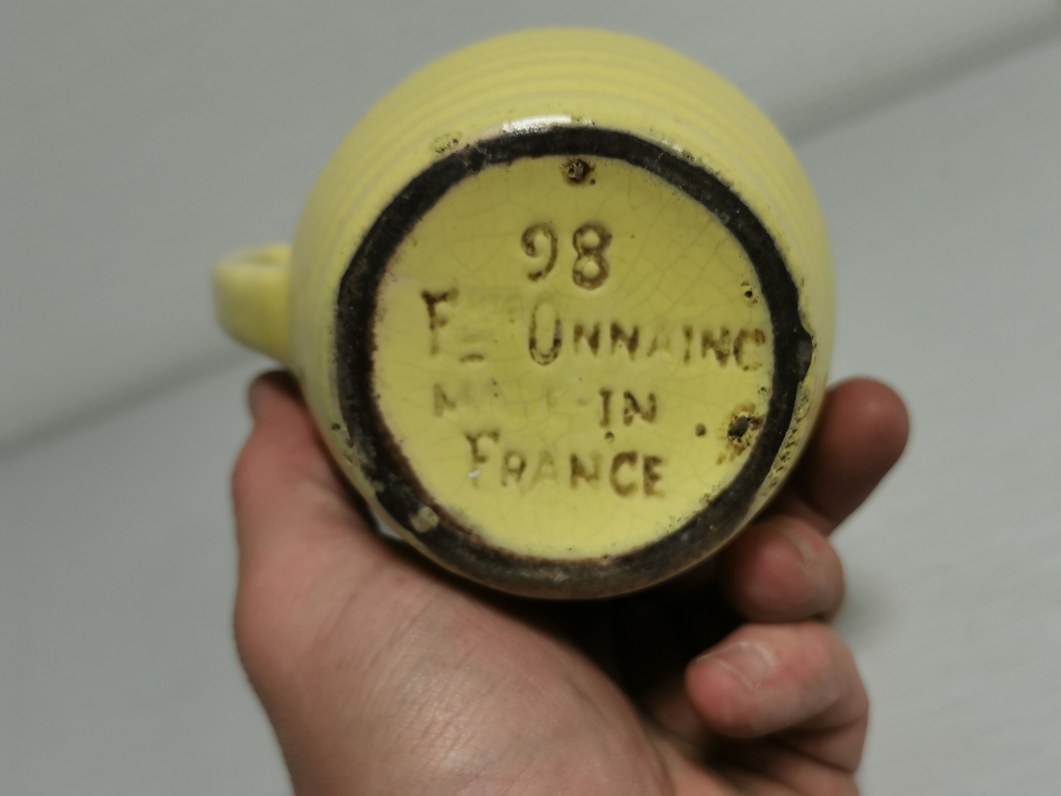 Yellow pitcher in slurry, faience onnaing frères