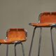 Set of 2 stools "Les Arcs" selected by Charlotte Perriand in leather.
