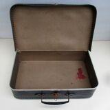 Small suitcase in old navy blue cardboard