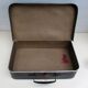 Small suitcase in old navy blue cardboard
