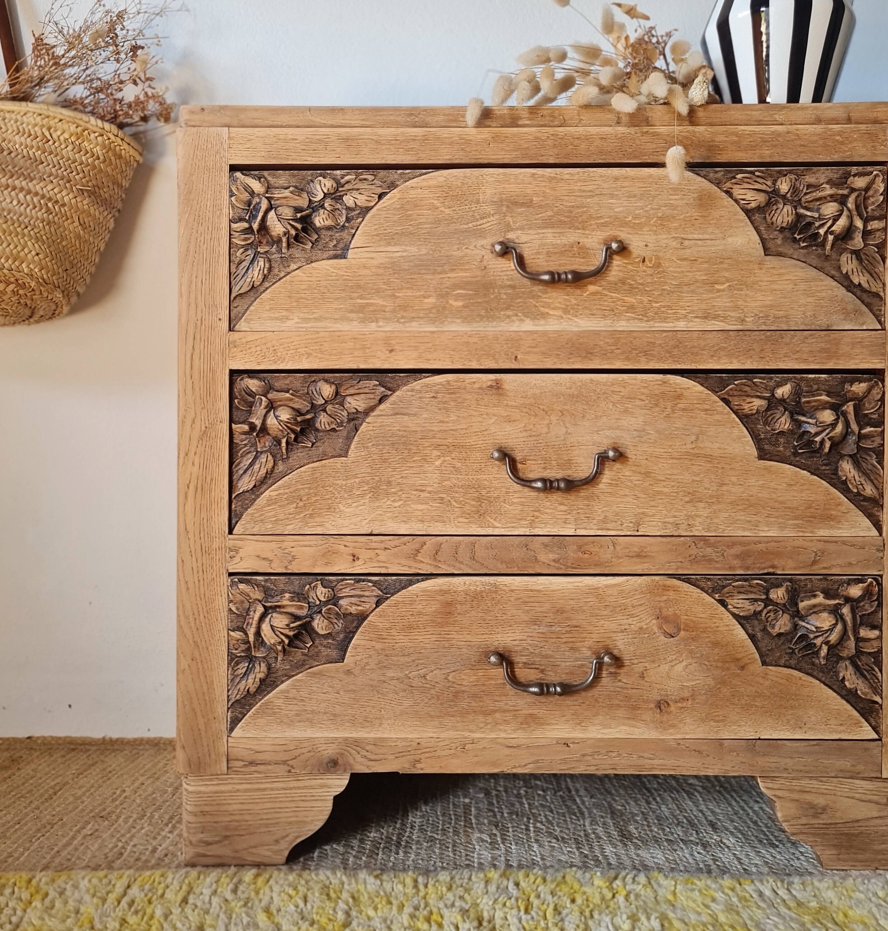 Art Deco chest of drawers in raw oak with carved drawers.