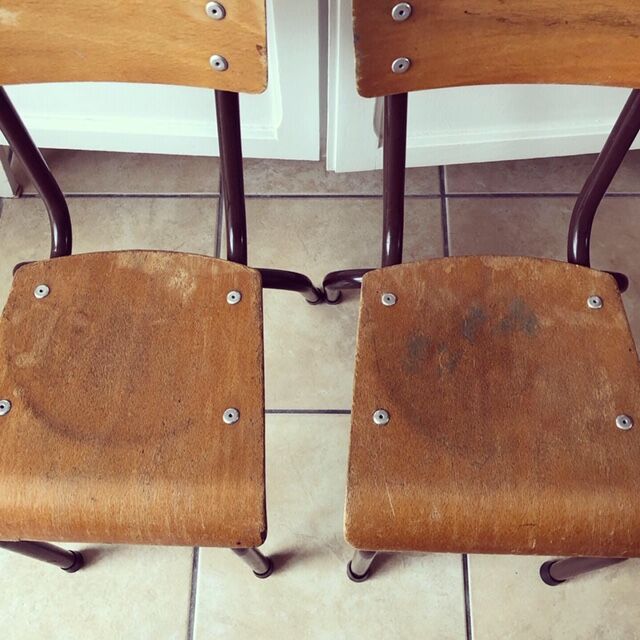 Duo of brown child school chairs