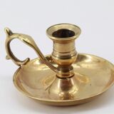 Old brass hand candle holder
