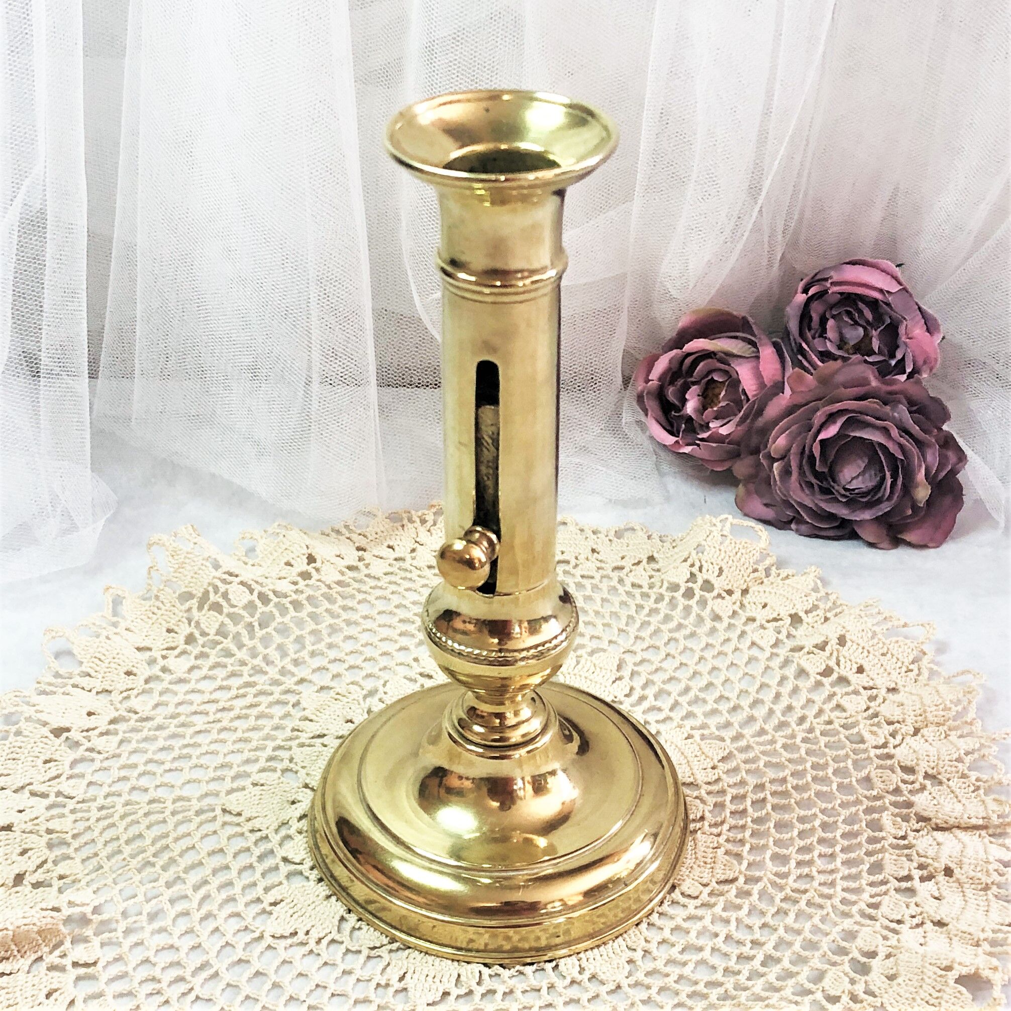 Gilded copper push candle holder
