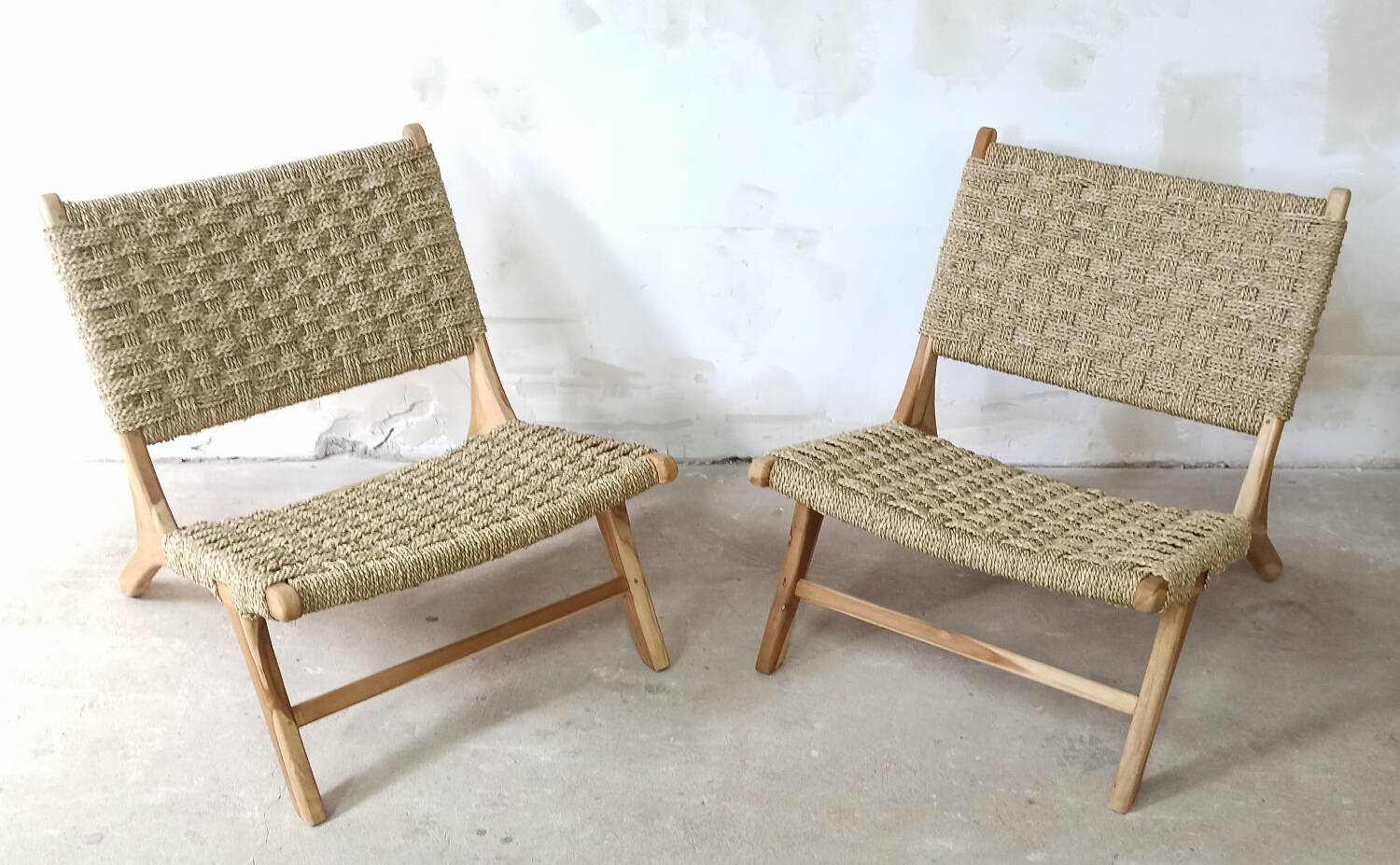 Pair of low armchairs in wood and woven rattan