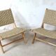Pair of low armchairs in wood and woven rattan