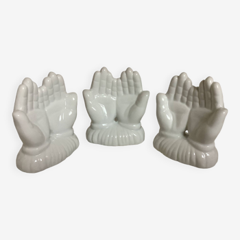 Trio of paperweight hands
