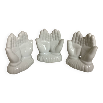 Trio of paperweight hands