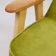 Fauteuil vintage en velours vert poire, bois naturel huilé.