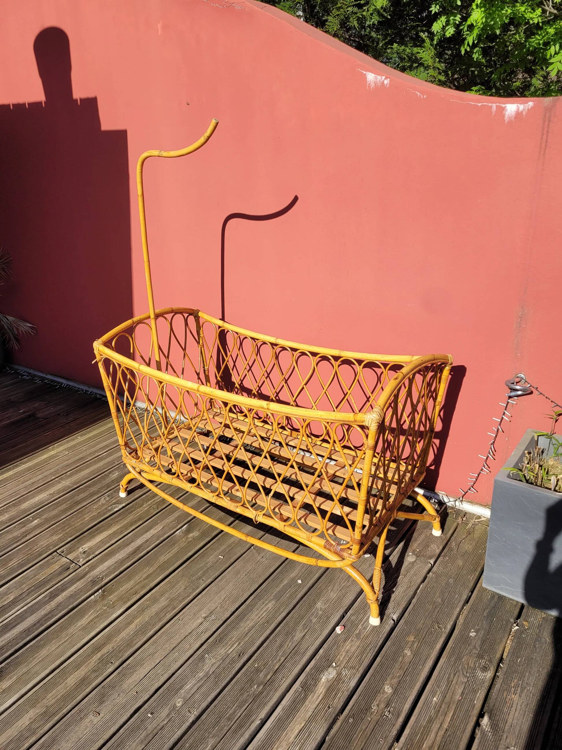 Bamboo and rattan baby cot with canopy.