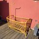 Bamboo and rattan baby cot with canopy.