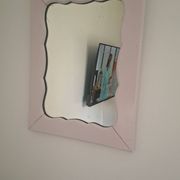 Mid-20th century rectangular wall mirror with a powder pink frame.