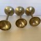 Trio of brass tulip foot candle holders