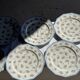Set of 10 flat plates in Limoges porcelain from France with flowers.